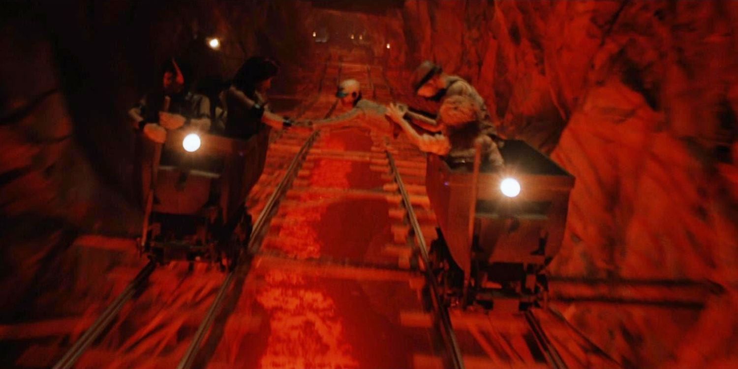Short Round is suspended between two carts racing in a mine in Indiana Jones &amp; the Temple of Doom.