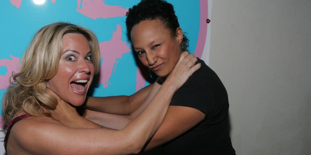 The Challenge star Coral Smith locks arms with a fellow contestant for The Challenge promo
