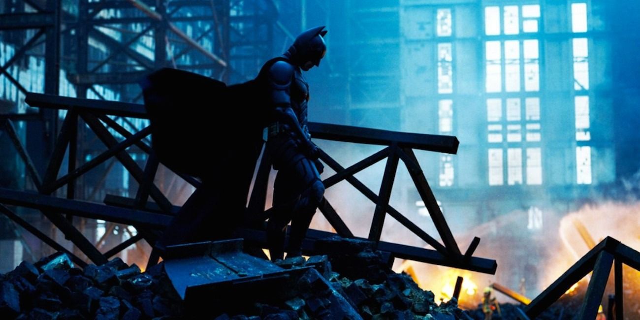 Batman standing over the rubble where Rachel died in The Dark Knight