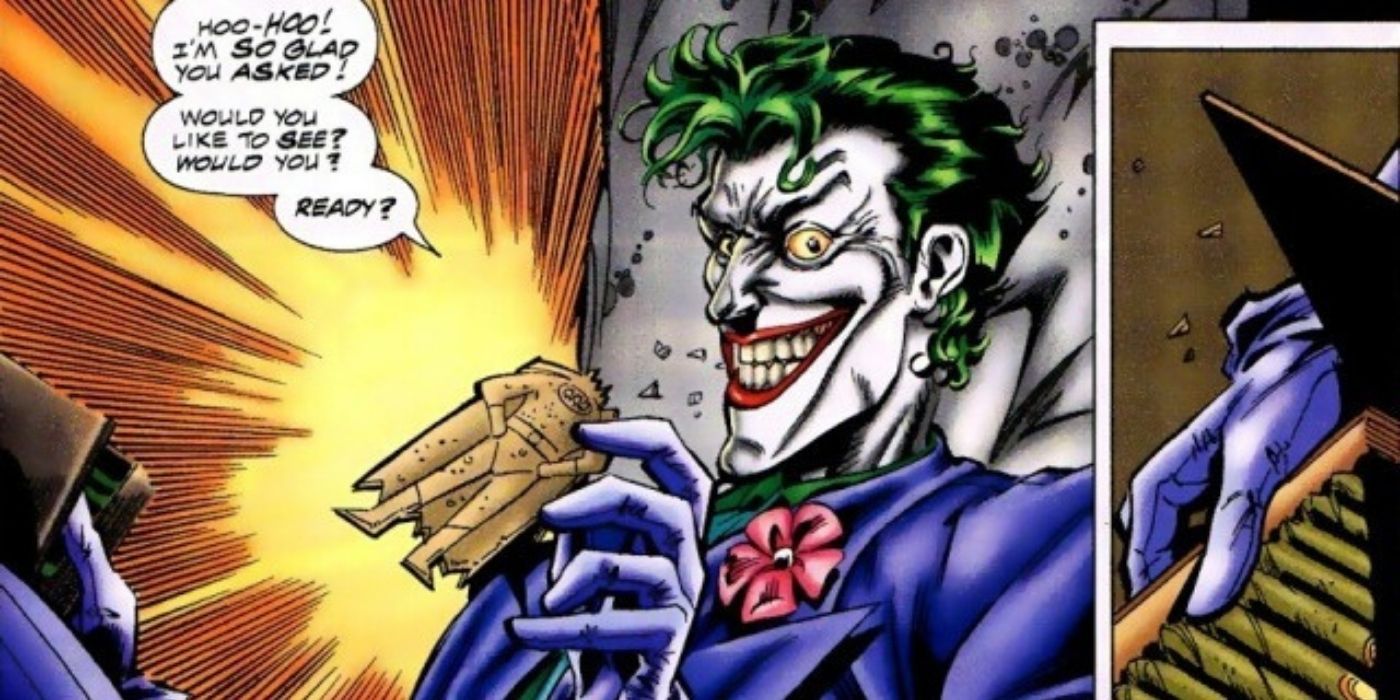 The Joker holding a cutout of Batman