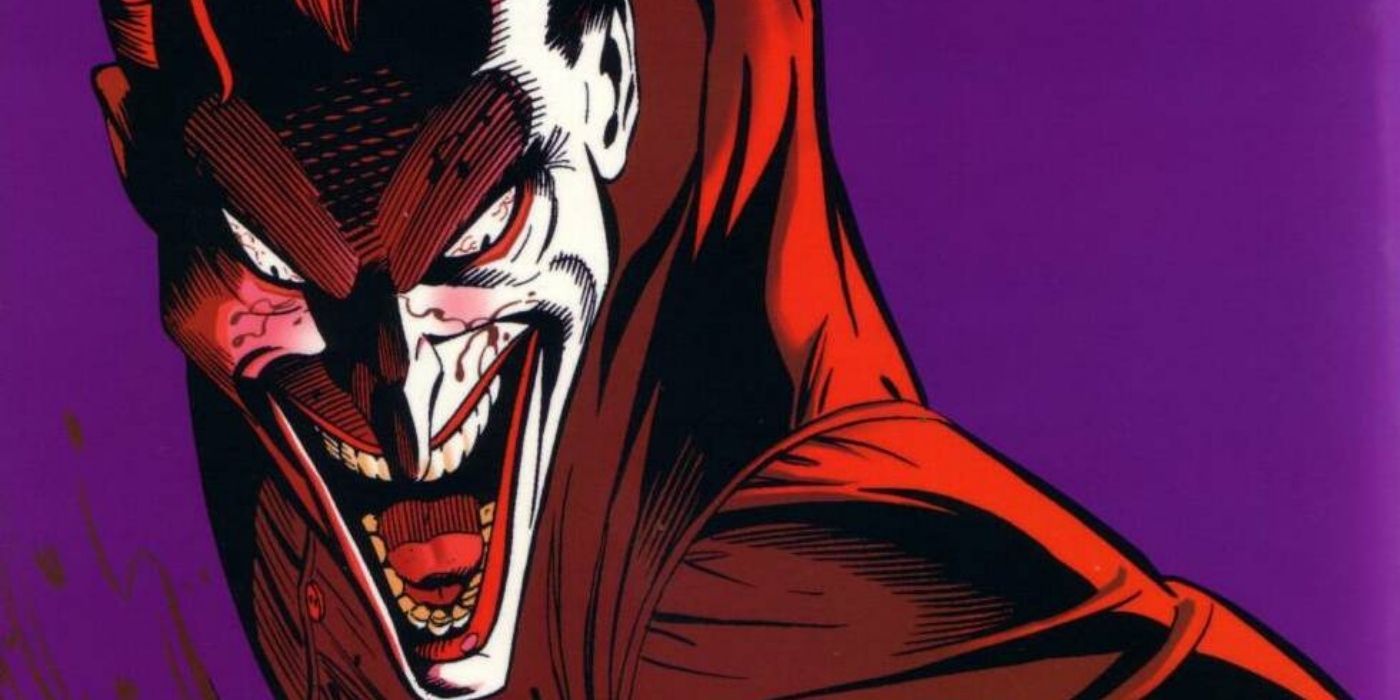 The Joker laughing and looking downwards