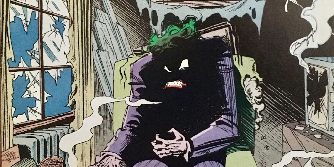 The Joker sitting on a chair and clenching his hands