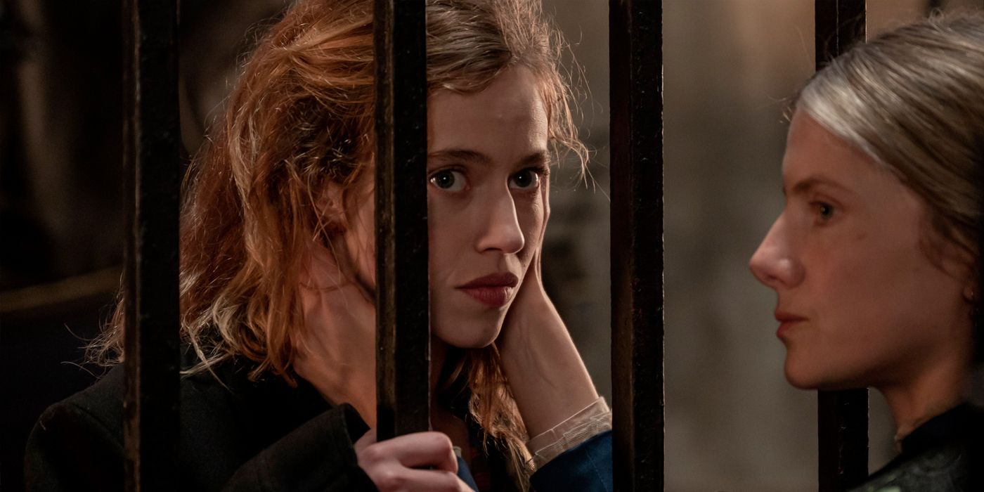 Melanie Laurent holds a girl&rsquo;s face through bars in The Mad Woman&rsquo;s Ball