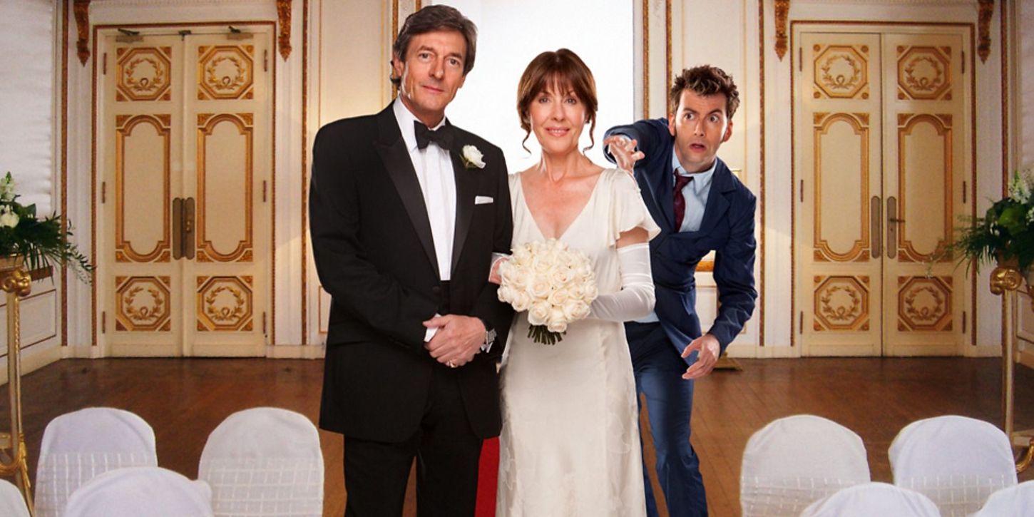 Sarah Jane stands at the altar with her husband and Doctor Who in The Wedding Of Sarah Jane Smith.