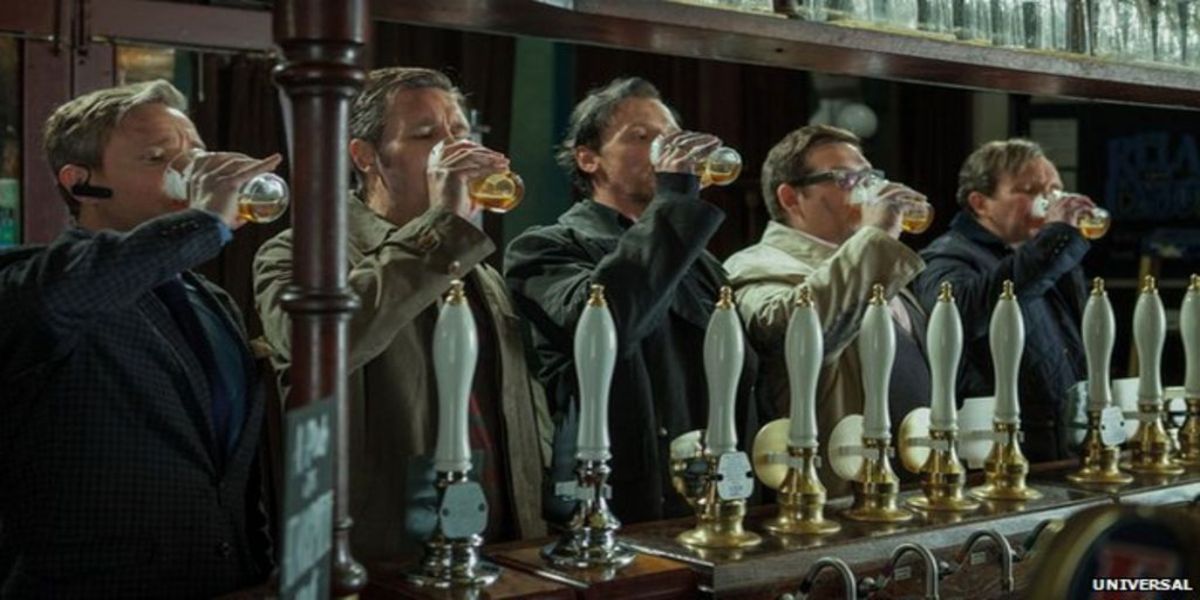 Five friends drink from their beer glasses in a pub in The World's End.