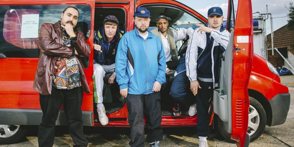 The gang standing in front of Chabuddy's van going to Ipswich in People Just Do Nothing.