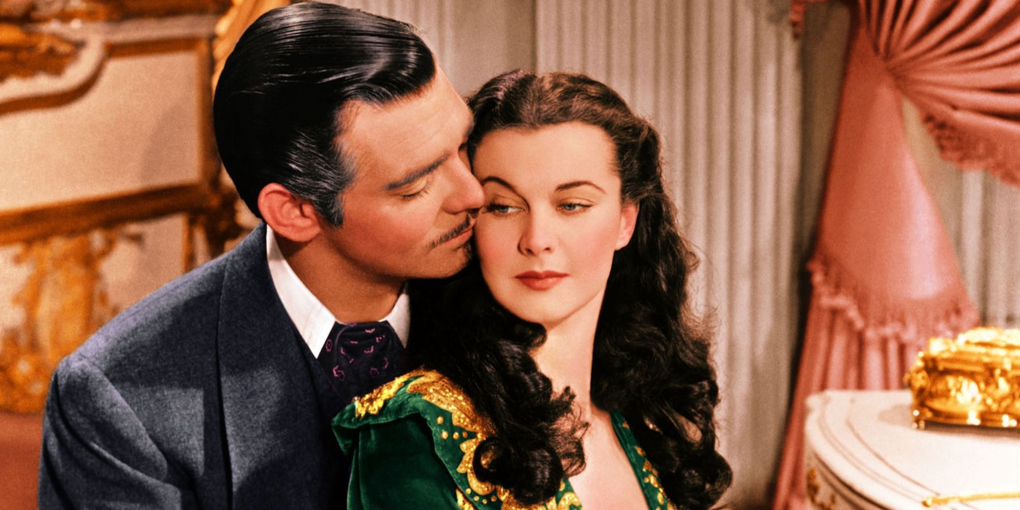Vivien Leigh and Clark Gable standing close together in Gone with the Wind