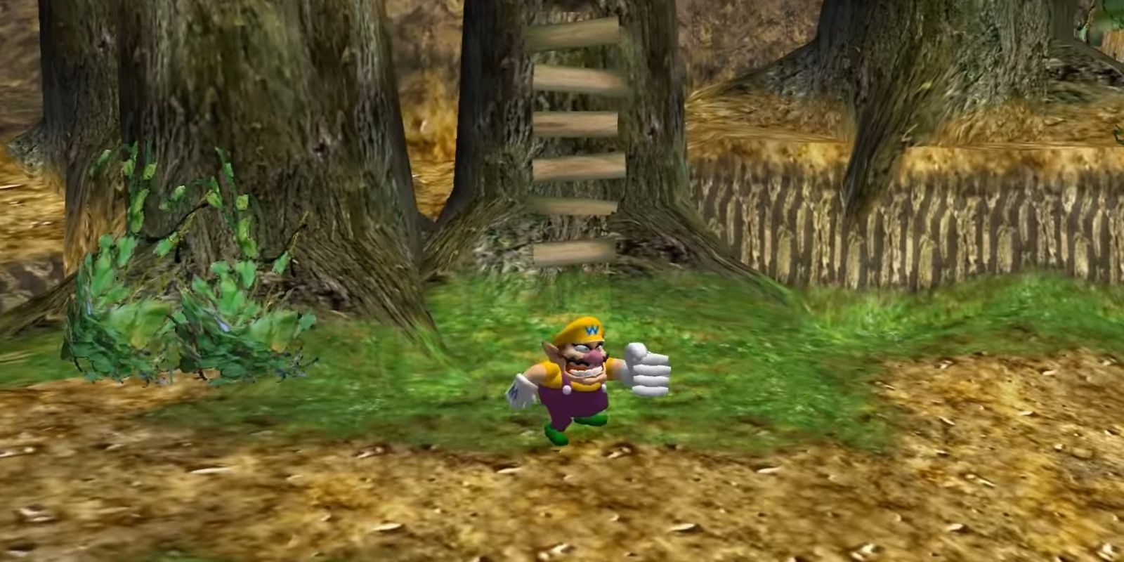 Wario punching with an enlarged fist in Wario World