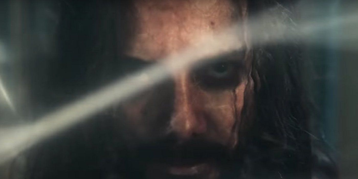 A closeup of Logain with a thread of the One Power in front of his face in The Wheel of Time