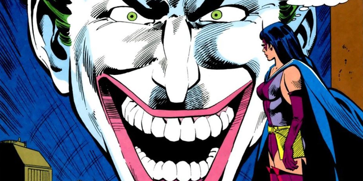 The Huntress looks at a giant image of the Joker in Wonder Woman: First Laugh.