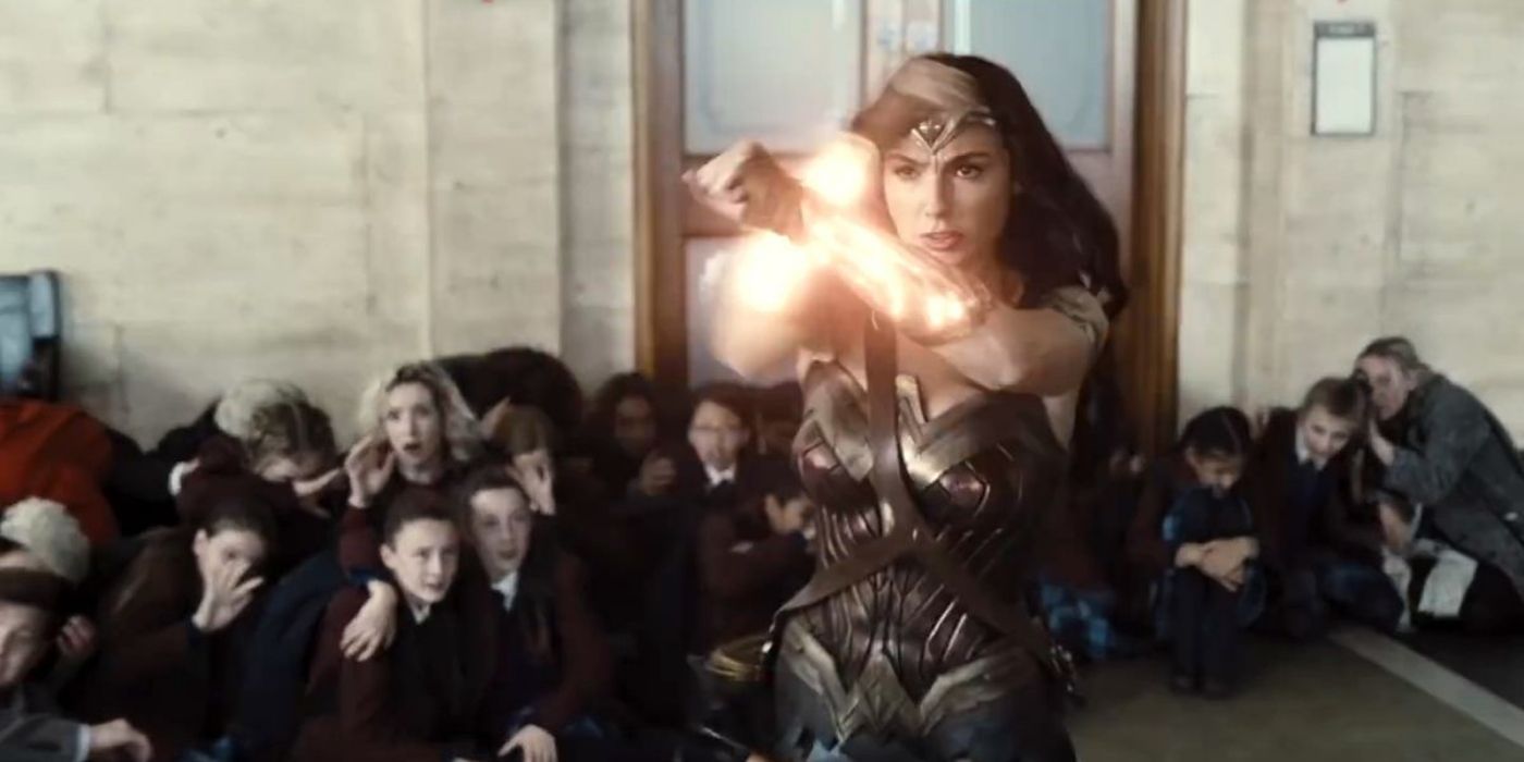 Wonder Woman using her power bracelets to protect hostages in Zack Snyder's Justice League