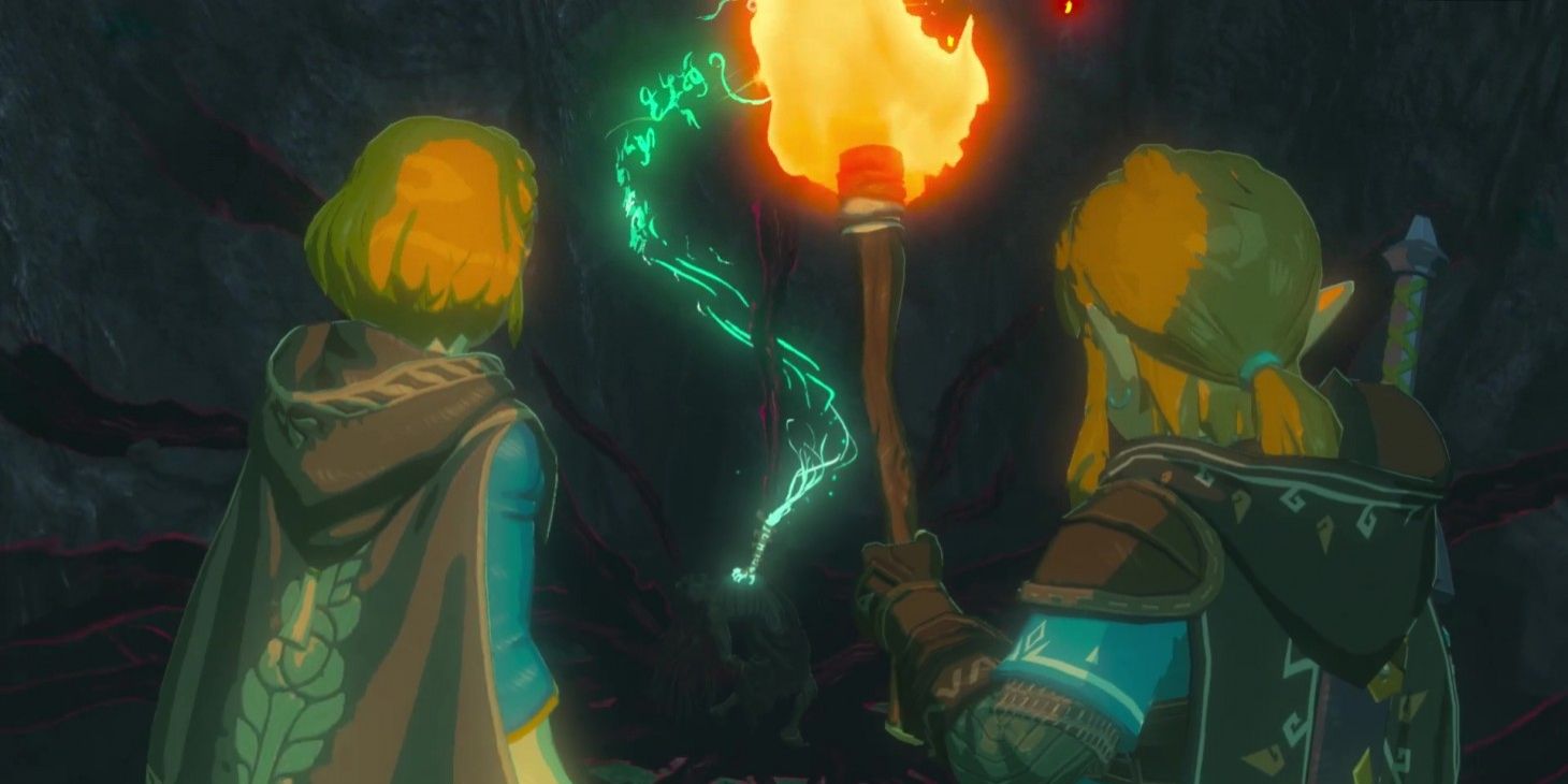 Zelda and Link stand outside a dark cave entrance in The Legend of Zelda: The Breath of the Wild 2.