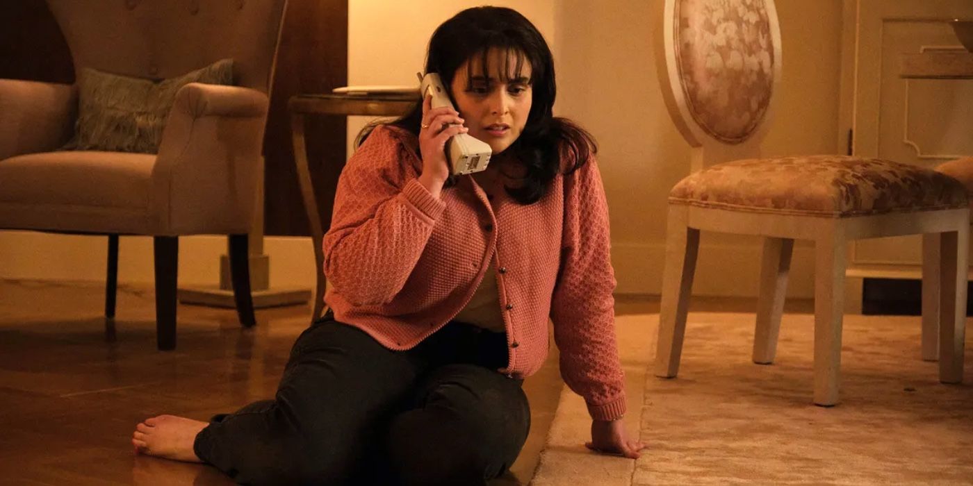 Monica Lewinsky sitting in the floor on the phone in Impeachment: American Crime Story