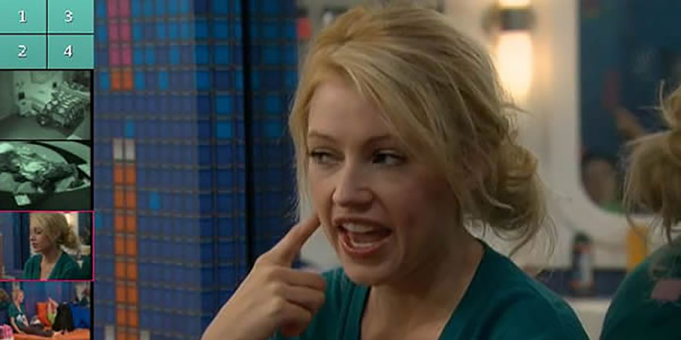 Britney from Big Brother holding her finger to her mouth.