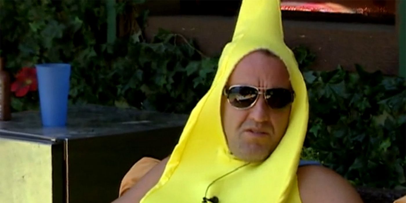 Casey dressed as a banana on Big Brother, sitting down outside with sunglasses on.