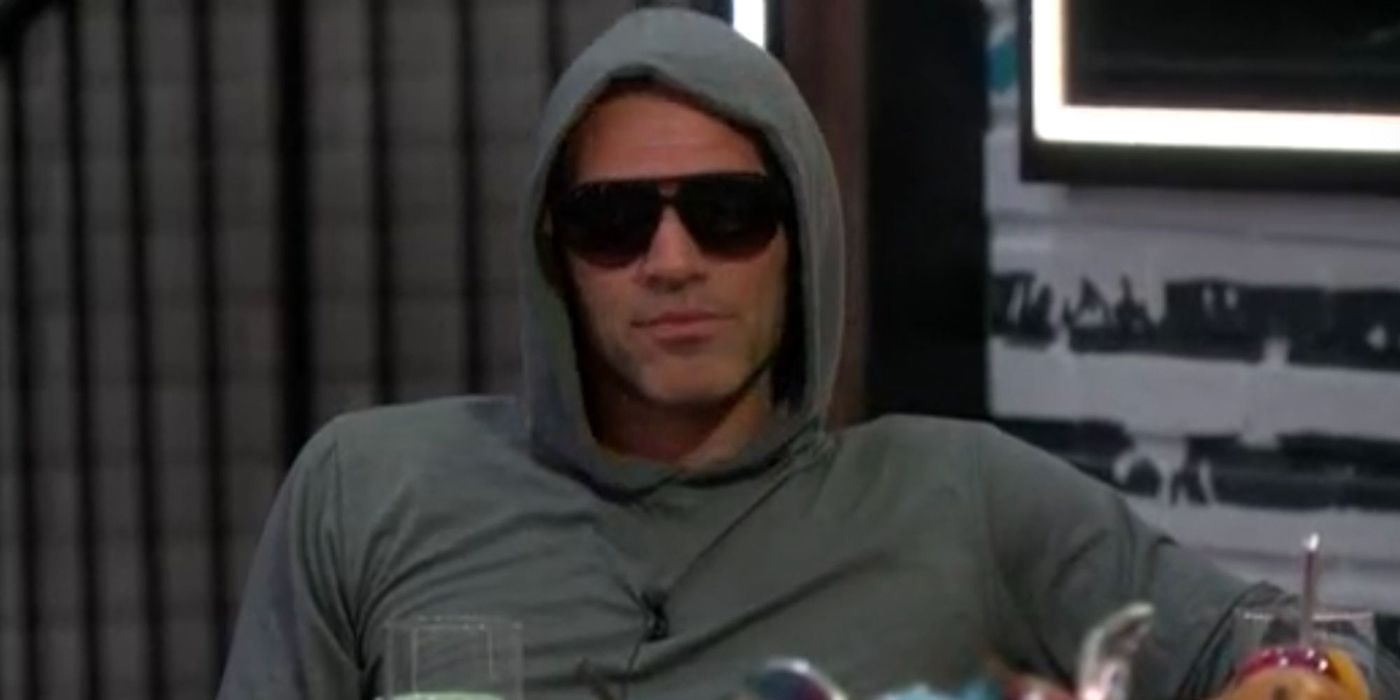 Enzo from Big Brother wearing sunglasses and a hoodie.