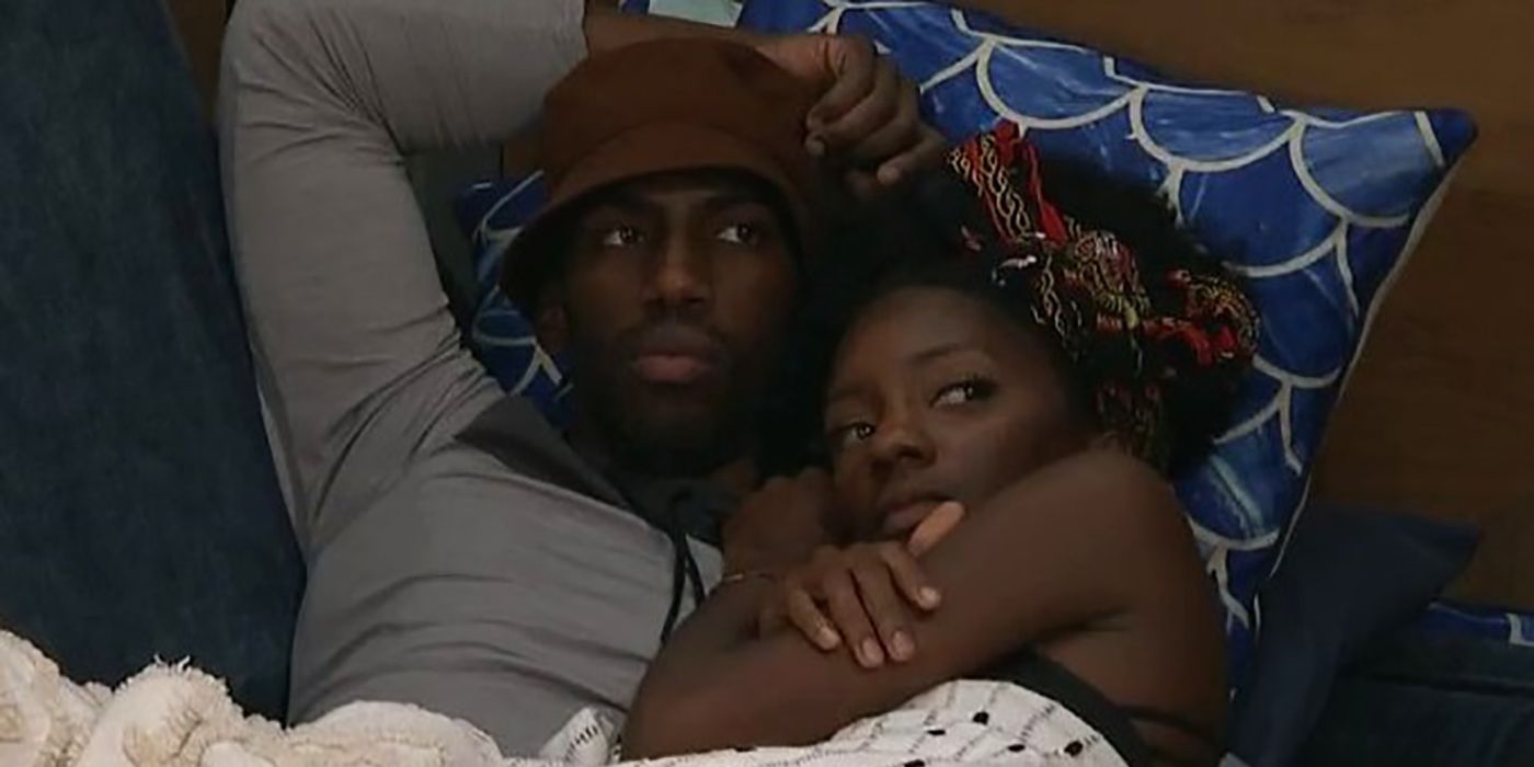 Xavier and Azah from Big Brother cuddling in bed together.