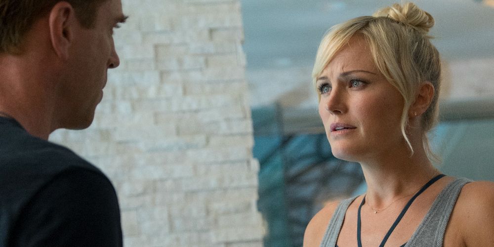 Lara confronts Bobby in a gray tank top on Billions
