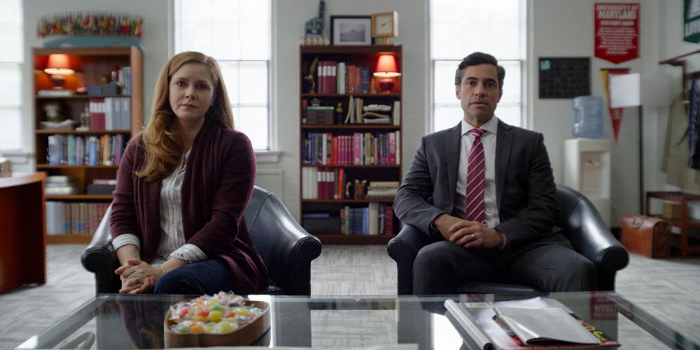 Cynthia and Larry sit in the principal's office in Dear Evan Hansen