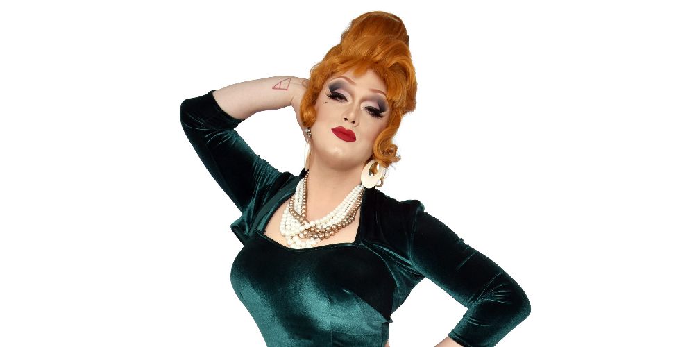 Jinkx Monsoon poses in an emerald dress for RuPaul's Drag Race