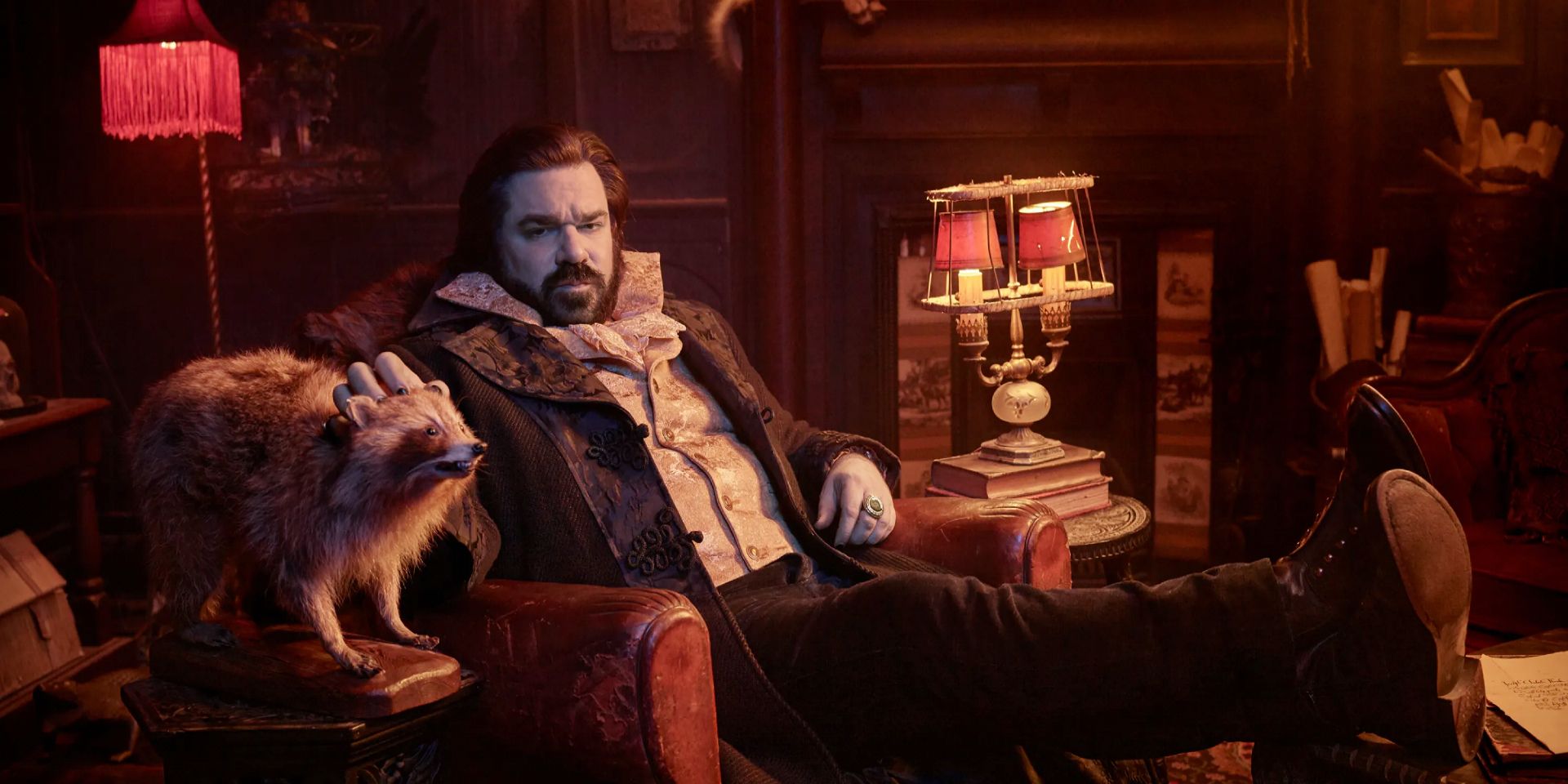 Laszlo sitting in a chair in What We Do in the Shadows