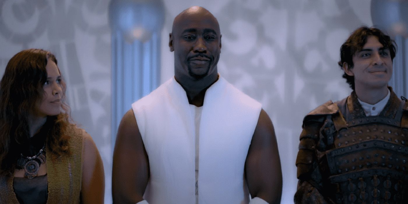 Amenadiel from Lucifer in all white, flanked by two of his siblings and he rules Heaven as God.