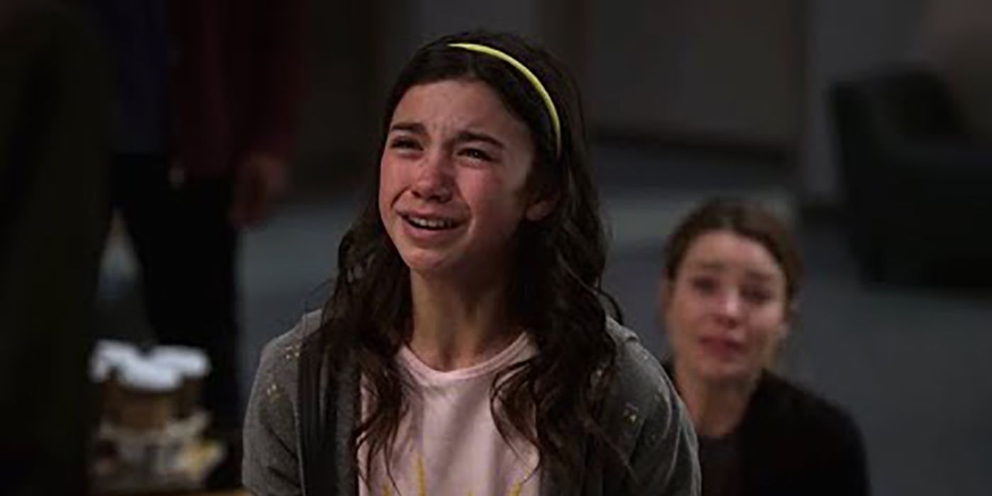 Trixie in the hospital crying, Chloe looking on in tears in a scene from Lucifer.