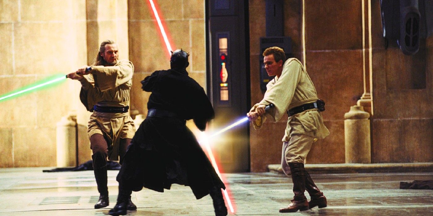 The duel of the fates battle in Episode I the Phantom Menace with Darth Maul clashing lightsabers with Qui-Gon Jinn and Obi-Wan Kenobi