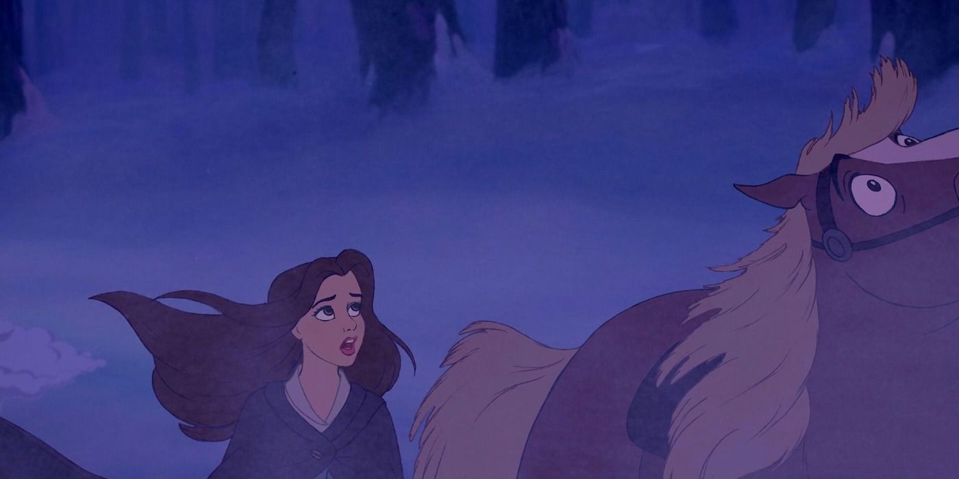 Belle staring up in horror alongside her horse in Beauty and the Beast