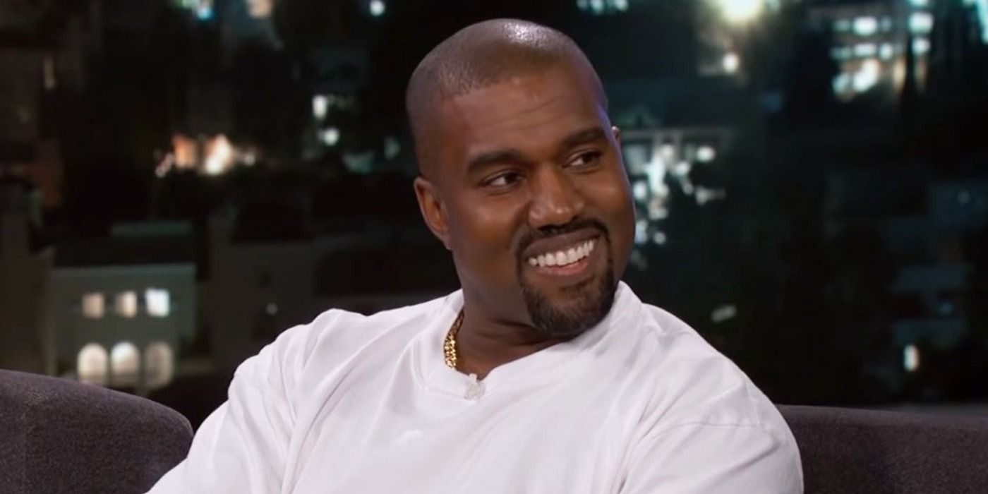 Kanye West smiling during a talk show appearance