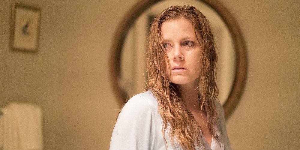 Camille appears like a ghost in white on Sharp Objects.