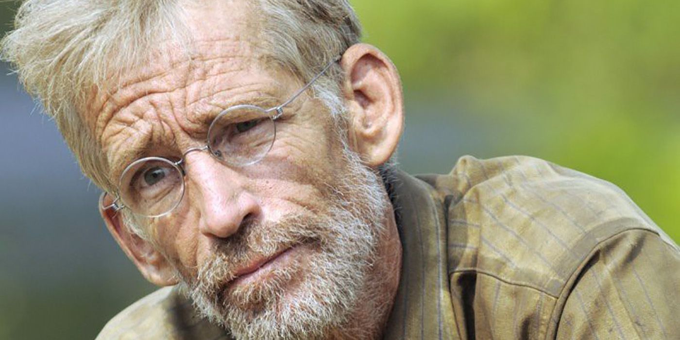 A close-up of Bob Crowley from Survivor, looking serious.