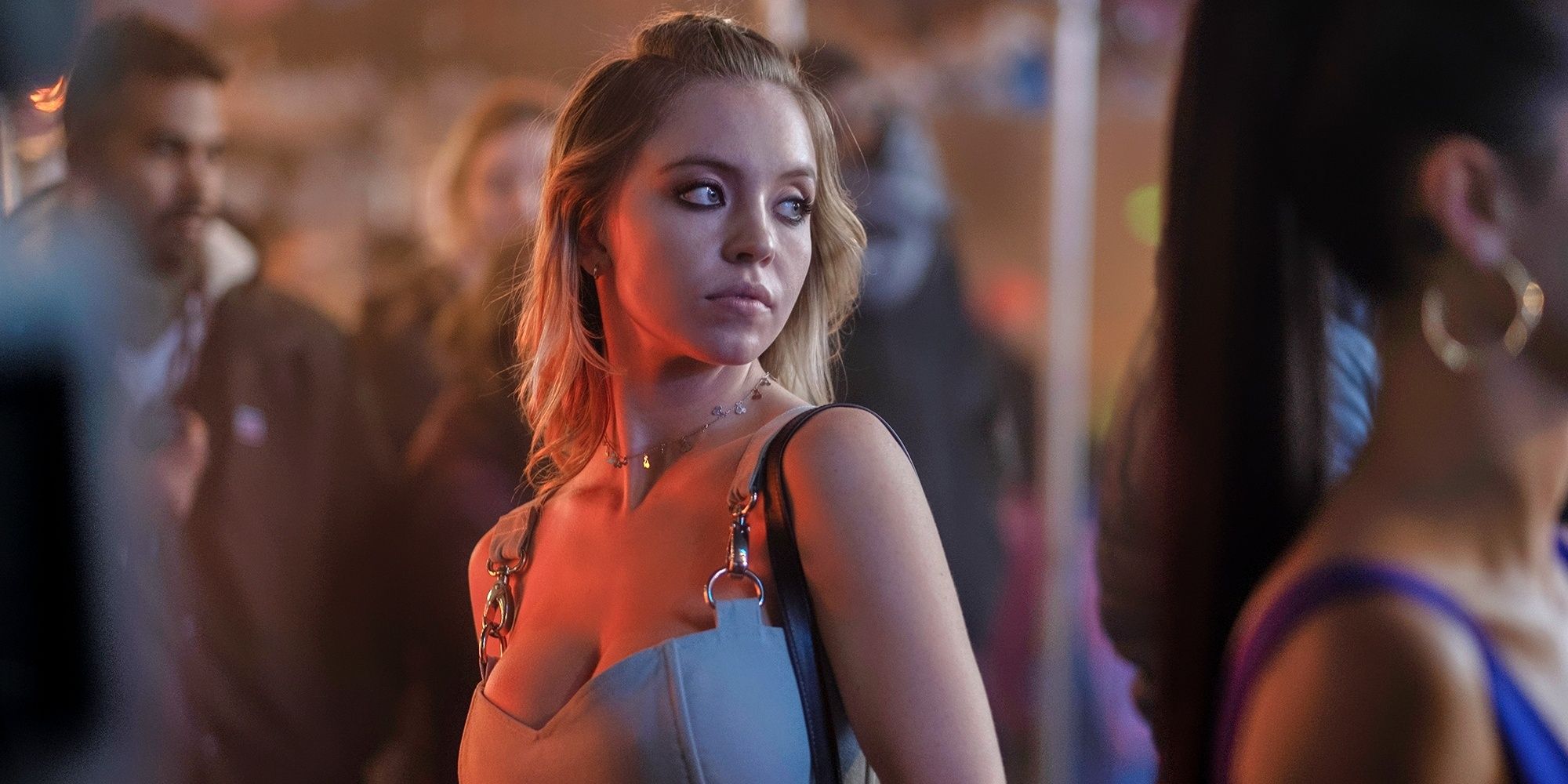 Sydney Sweeney as Cassie looking back around her in Euphoria