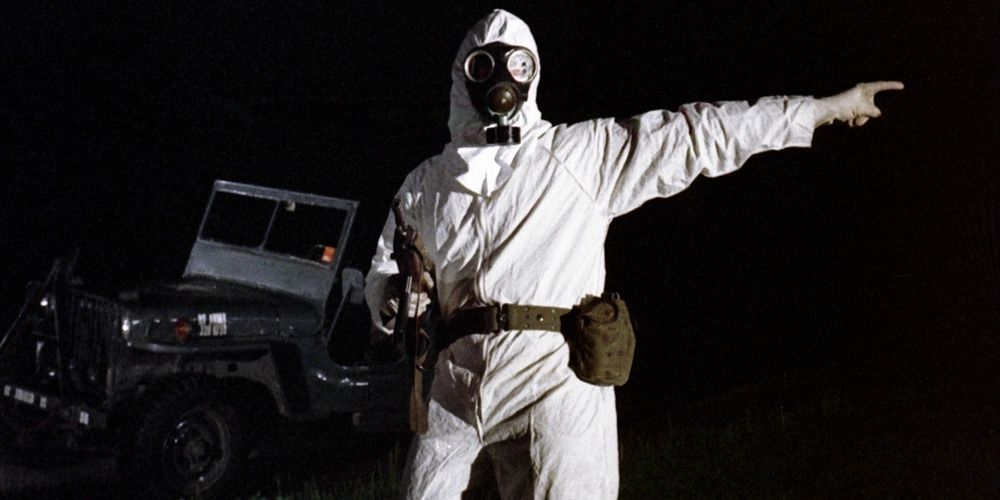 A soldier wears a white suit and gas mask in The Crazies