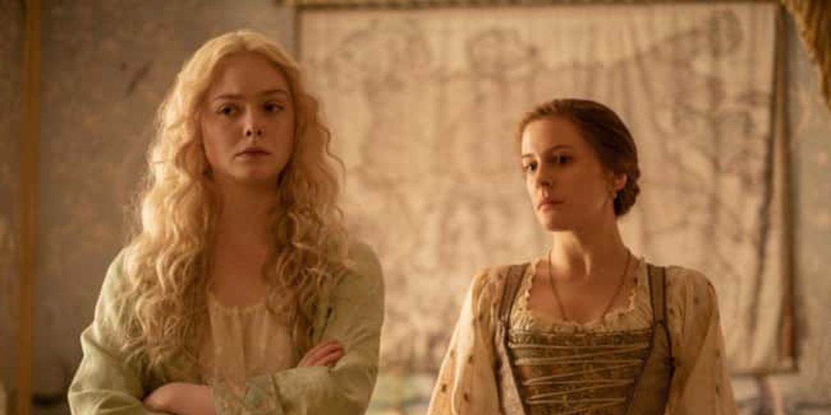 Catheirne (Elle Fanning) looking cross while chatting with her servant Marial (Phoebe Fox) in The Great