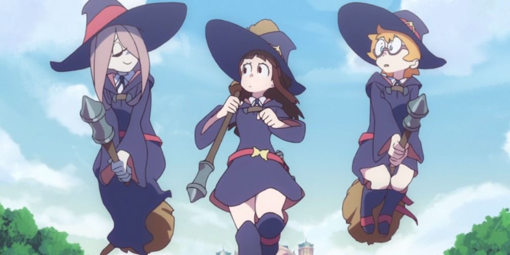 The three main characters of Little Witch Academia, two of them are flying on brooms and Akko is running on the ground between them