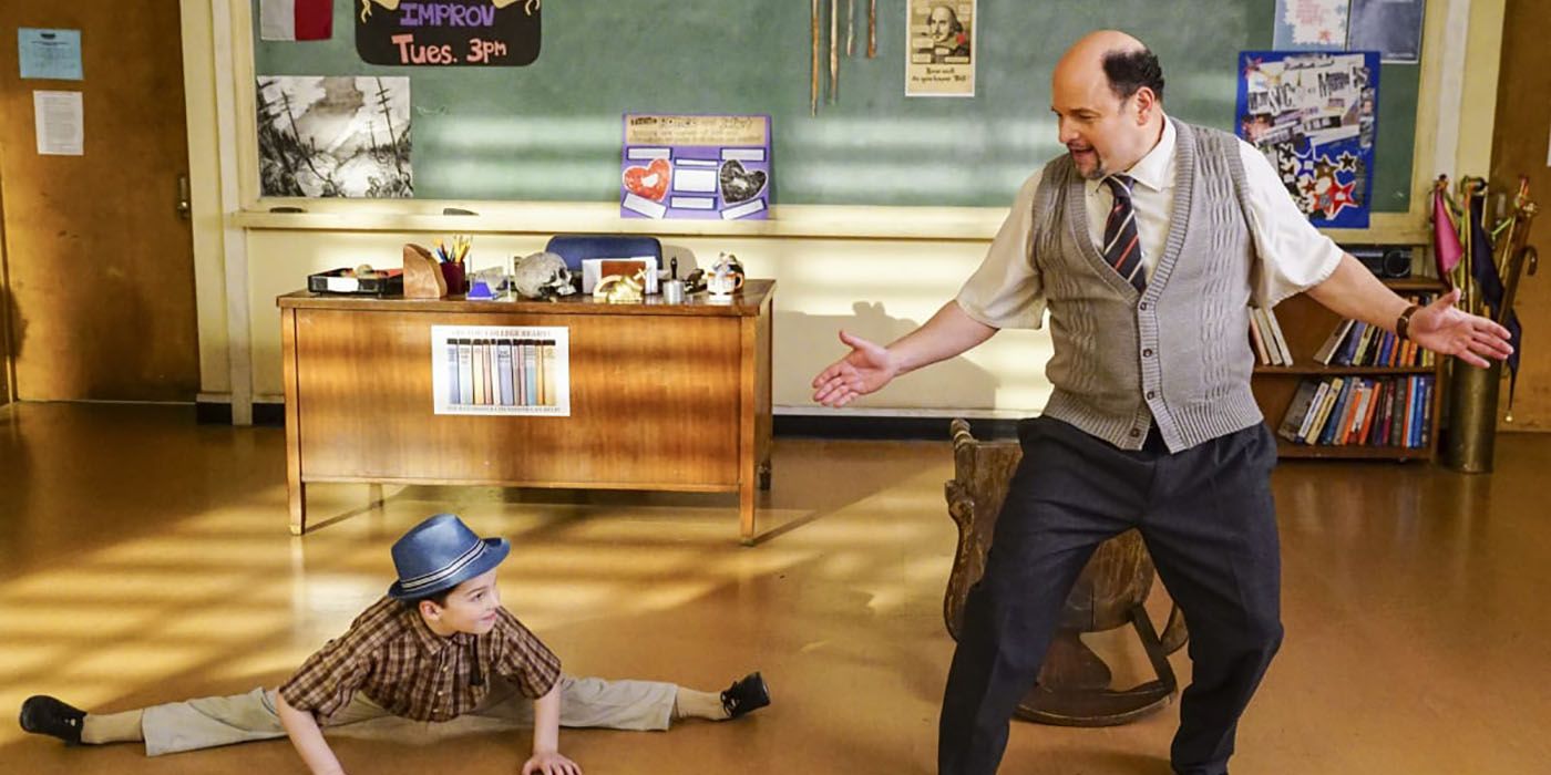 Dr. Lundy from Young Sheldon dancing in his classroom, Sheldon beside him doing the splits.