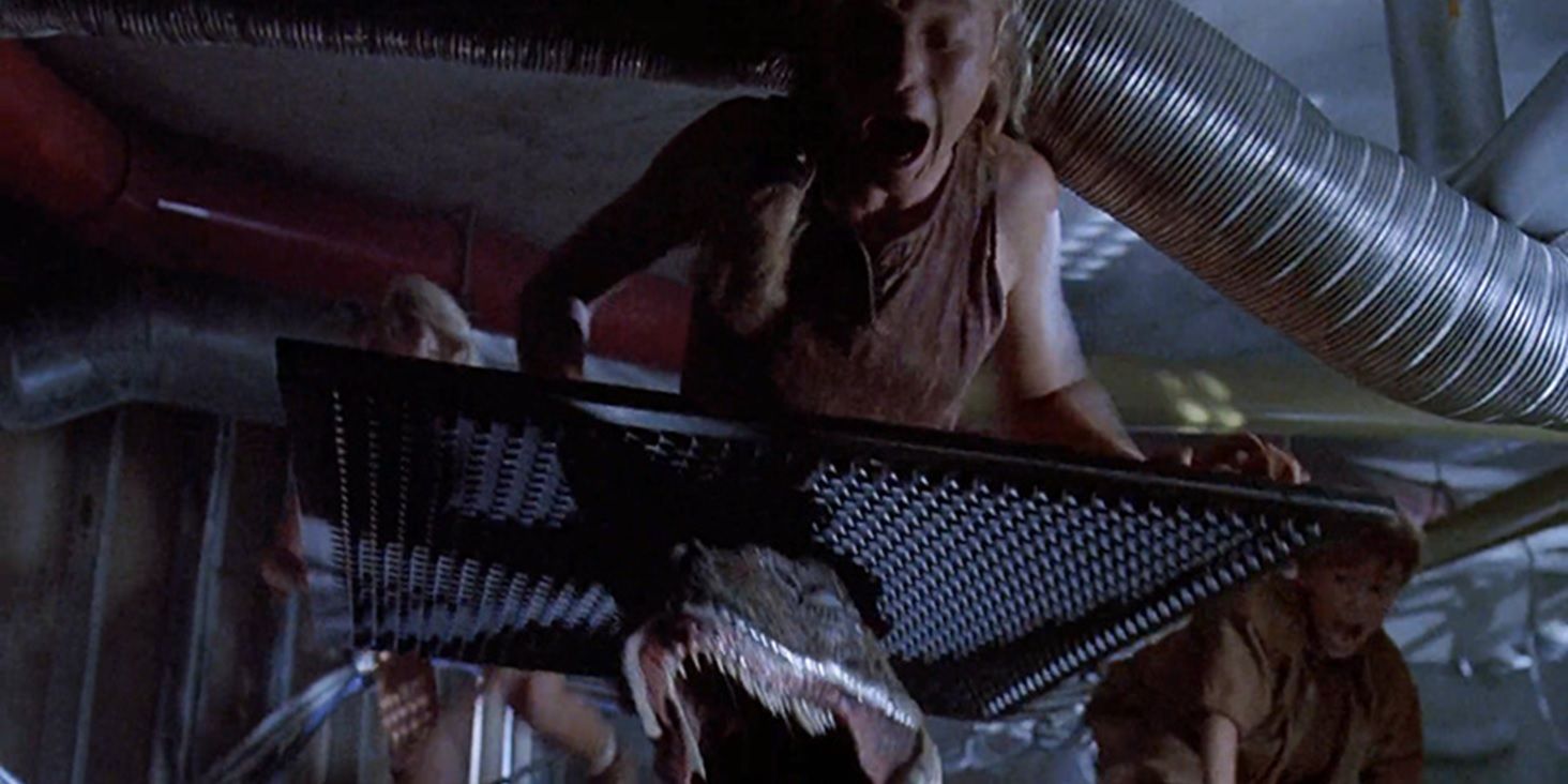 A raptor attacks Lex in the ceiling in Jurassic Park