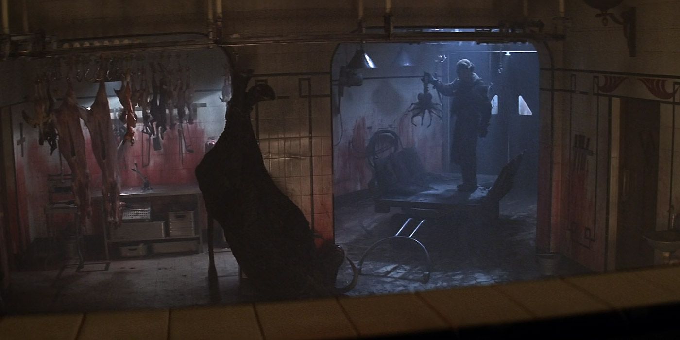 A prisoner holds up a dead facehugger in Alien 3