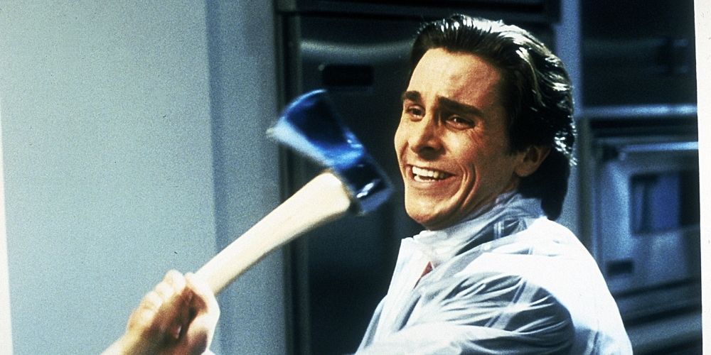 Patrick Bateman laughing while swinging an axe in American Psycho.