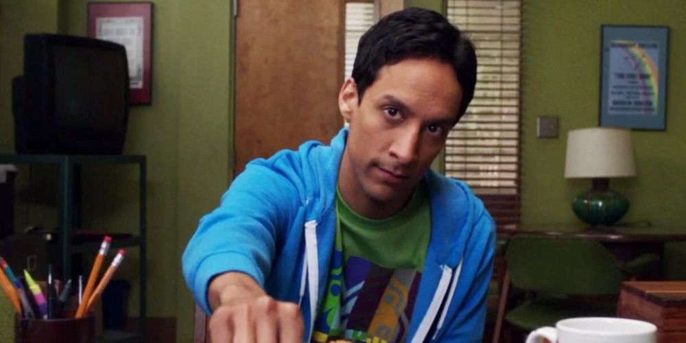 An image of Abed sitting in an office in Community