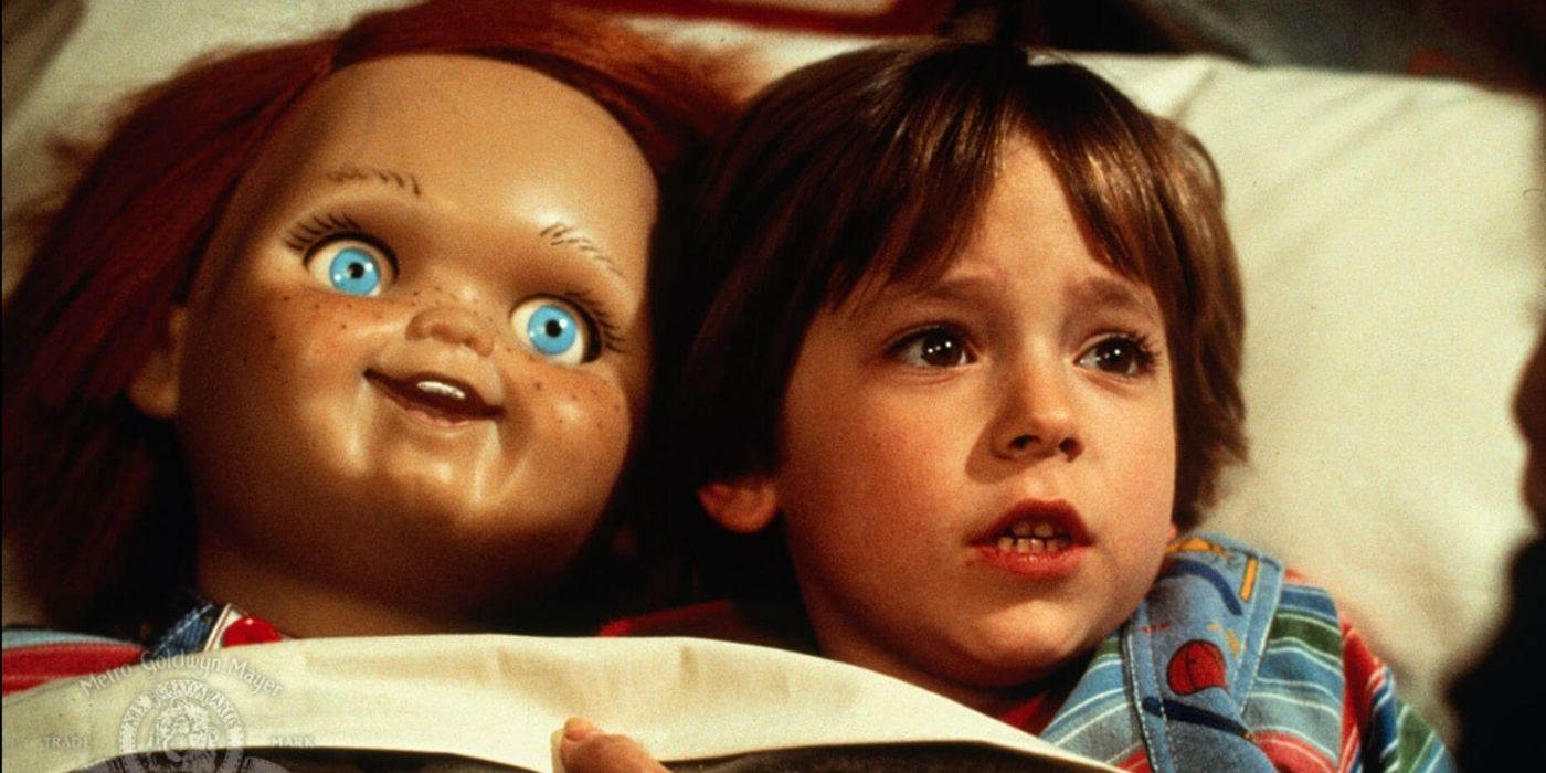 Andy in bed with Chucky in Child's Play.