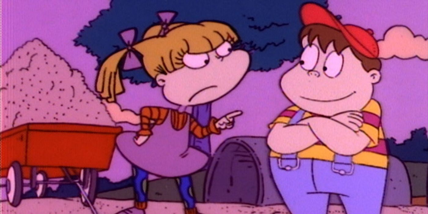Angelica points at Josh on the playground in Rugrats
