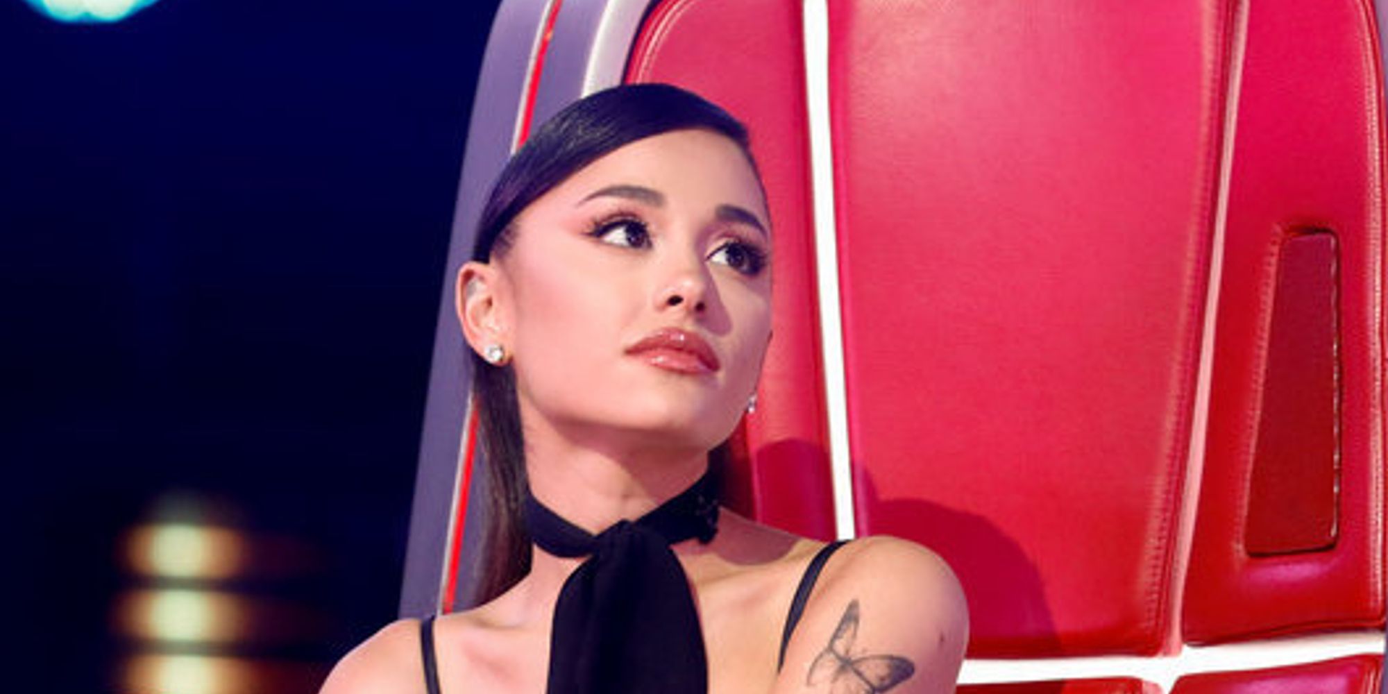 Ariana Grande on The Voice season 21 sitting on red chair