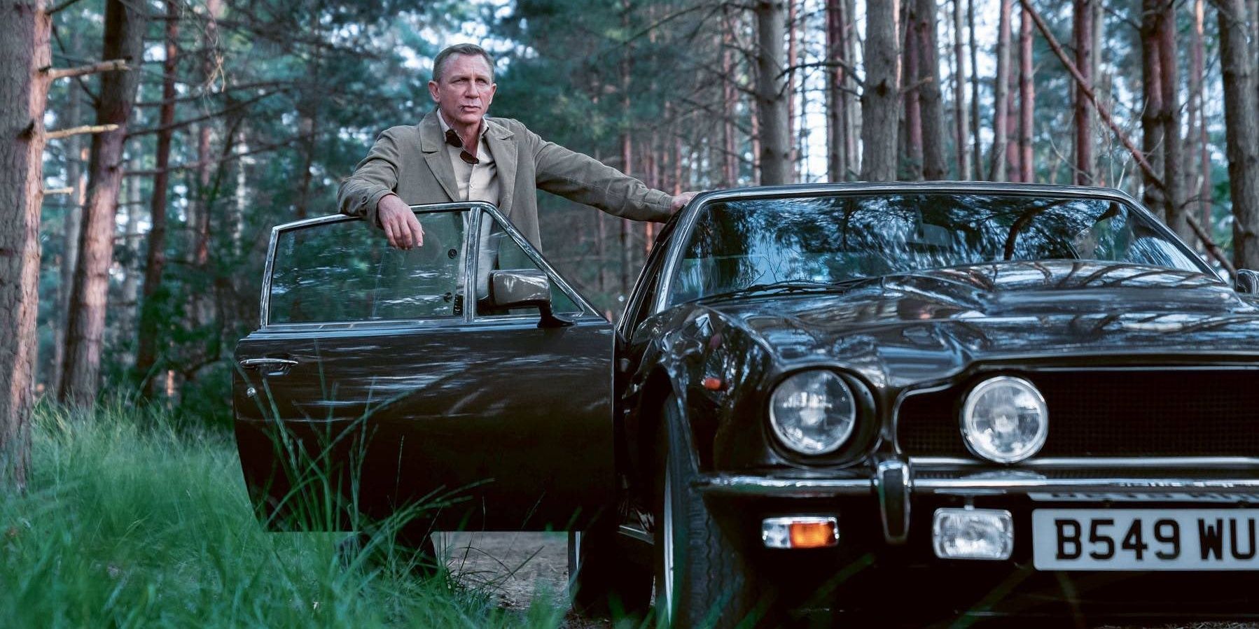 Bond steps out of his Aston Martin V8 Vantage in No Time To Die