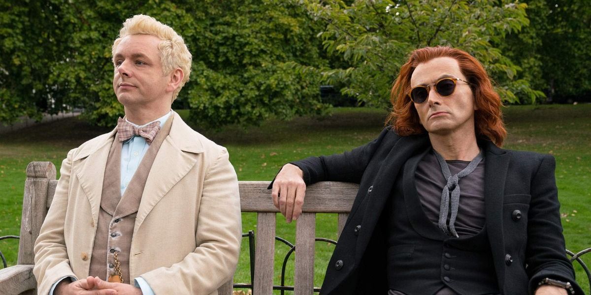 Aziraphale and Crowley in Good Omens sat on a bench together