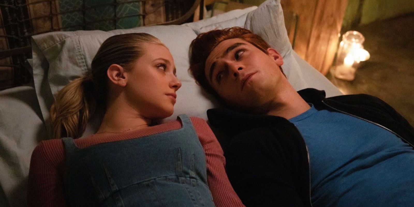 Betty lays in bed with Archie on Riverdale