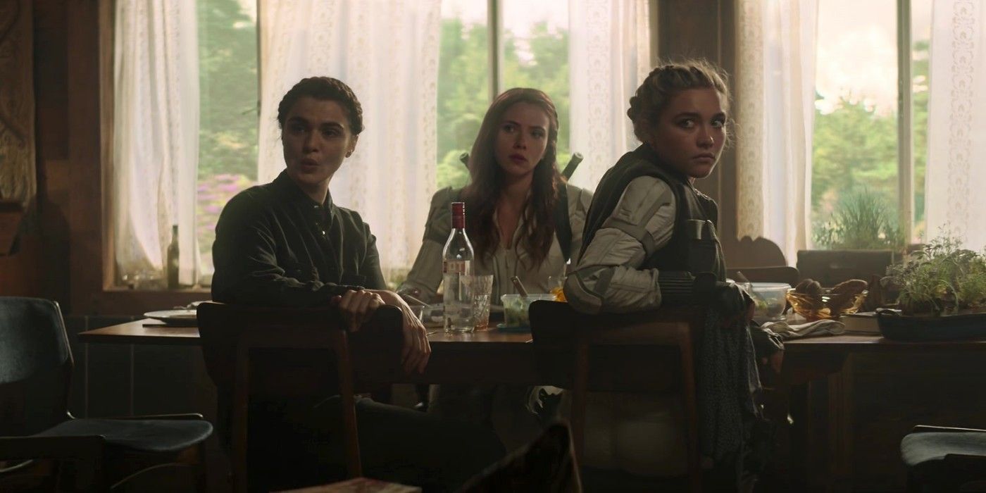 Melina, Natasha, and Yelena sit at the dinner table in Black Widow