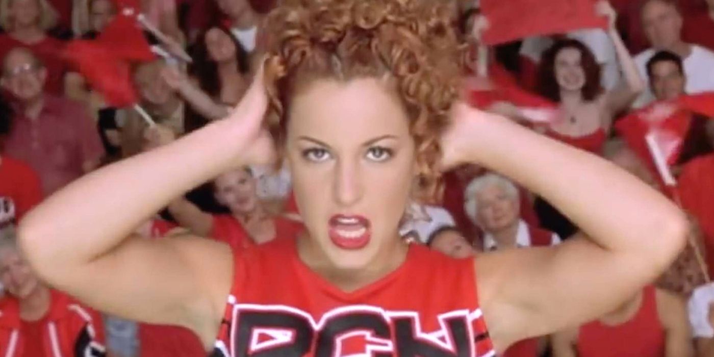 Big Red holding her head during a cheer routine in Bring It On