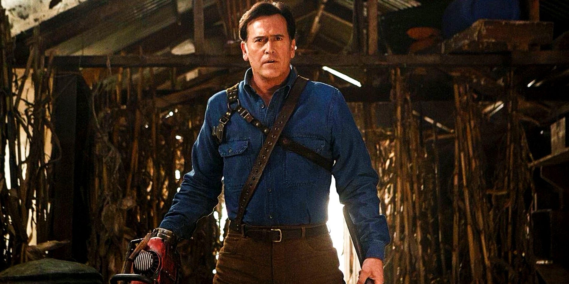 Ash confronts a monster in Ash vs. The Evil Dead, standing and looking at something.